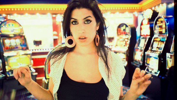 Like many addicts and alcoholics, Amy Winehouse lived a colorful life before her addiction completely took hold. (Jake Chessum)
