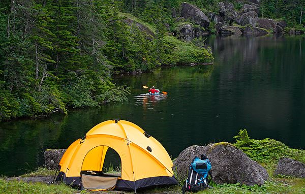 A backpacker enjoying a pack raft while camping on Culross Camping was one of the first forms of adventure therapy that ever existed. (Ron Niebrugge/WildNatureImages)