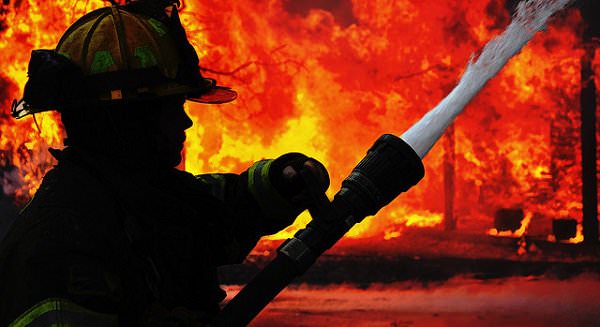 If we are willing and open-minded, we can extinguish the flames of our anger through love and understanding. (Photo via Labor Tribune)