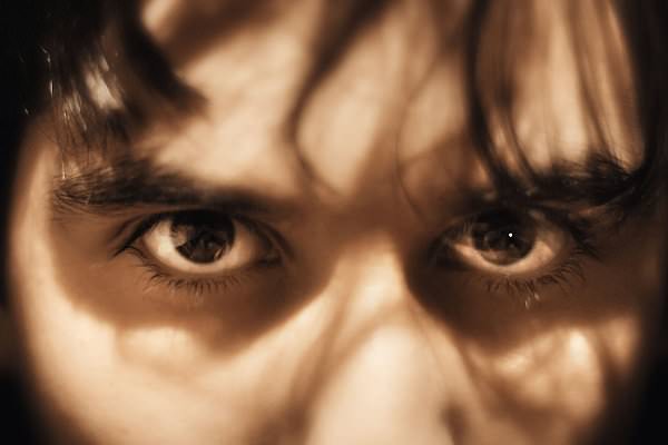 During the first three stages, a person might act as if they are not grieving. But the truth is often hidden in their eyes. (Wikimedia Commons)