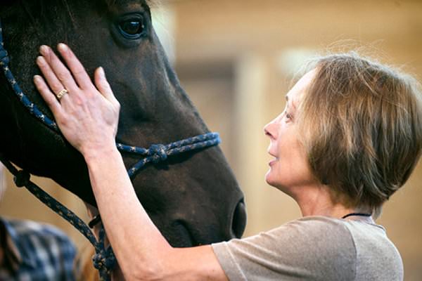 Equine therapy offers patients a fun and unique way of getting to know more about themselves. (Gary Howe/The New York Times)