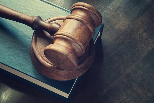 Anyone who’s made their living dealing drugs probably has a fair array of legal issues that require attending. (Evlakhov Valeriy/Shutterstock)