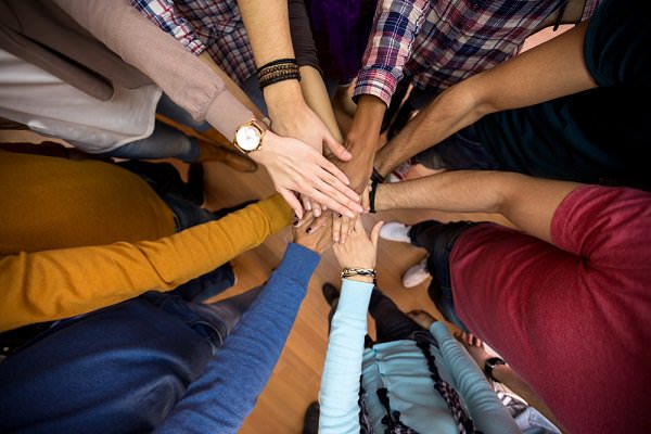 The First Tradition states that we must rely upon common welfare. In a program designed to promote fellowship, this dictum is most sound. (Lucky Business/Shutterstock)