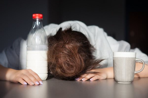 Drink as much milk and coffee as you want. That headache isn’t going away until it’s good and ready. (NinaMalyna/Shutterstock)