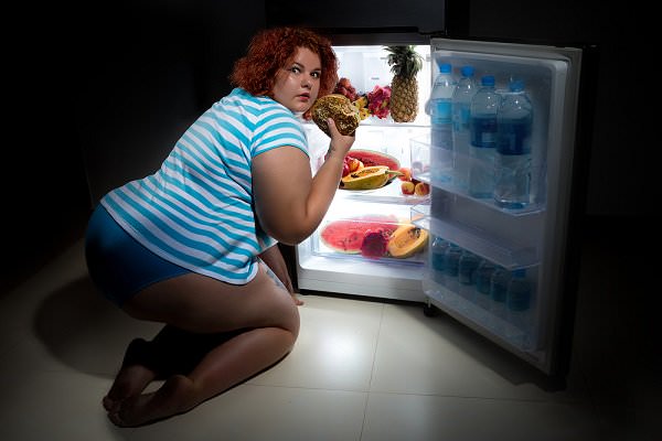 One thing eating has in common with drinking and drug abuse—if you’re doing it in secret, it’s become a problem. (Wallenrock/Shutterstock)