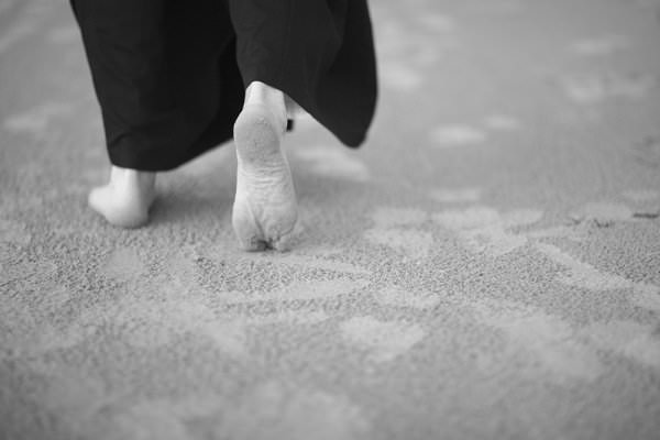 The practice of walking meditation will serve the dual purpose of providing light exercise while also allowing you to clear your head and overcome your urges. (Anna Jurkovska/Shutterstock)