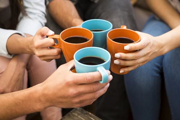Showing up early to meetings gives you a chance to perform a bit of service work by making coffee and talking to the other attendees. (iko/Shutterstock)