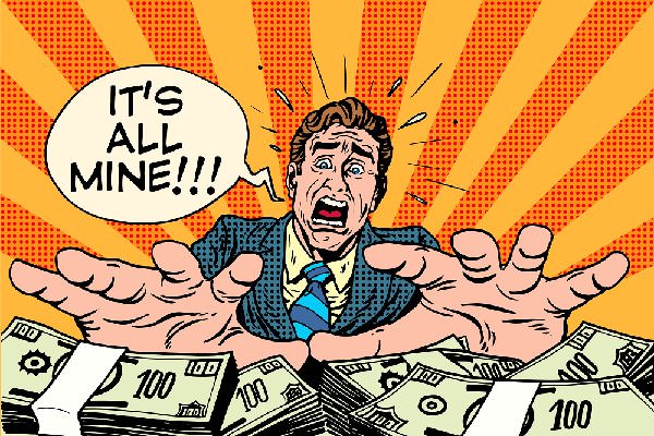 Notice how he isn’t just hoarding the money, but looks practically terrified that he’ll lose it somehow. Greed can do that to you. (studiostoks/Shutterstock)