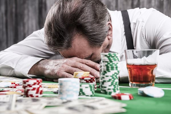 Alcoholism and gambling addiction not only accompany each other quite frequently, but also share a few similarities in terms of how they affect the brain. (g-stockstudio/Shutterstock)