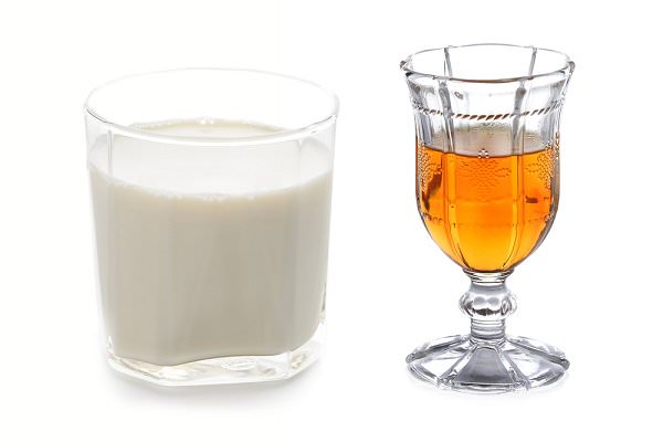 One would not expect an ounce of whiskey in a full glass of milk to pose much of a threat. For the recovering alcoholic, however, it can be the start of a long an drawn-out downward spiral. (Idea tank/Shutterstock)