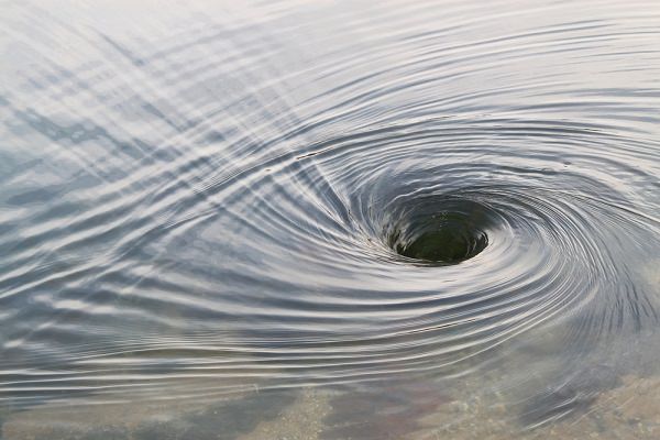 Like any other downward spiral, self-medication is a dangerous vortex that may suck us in until we hit rock bottom. (Elaine Davis/Shutterstock)