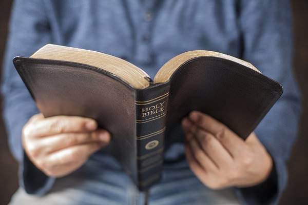 There are some who believe AA and NA should be used to preach, but this interpretation may go against the Sixth Tradition. (Anelina/Shutterstock)