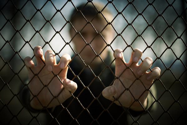 Right now, there are thousands of addicts serving life sentences for non-violent crimes. This is not justice. (luxorphoto/Shutterstock)