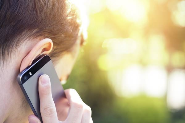 Whether in person or on the phone, talking to our sponsors and other fellow sufferers will help us see our lives more objectively. (guteksk7/Shutterstock)