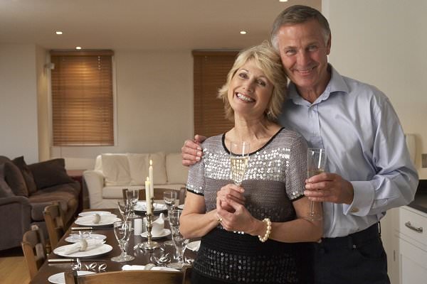 These two clearly mean well. But judging by the table settings, they’re also the kind of hosts who believe that everyone at a party should have a wine glass in front of them. (Monkey Business Images/Shutterstock)