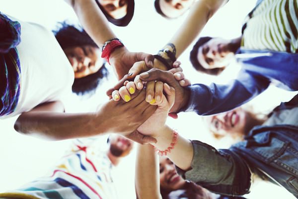 We’re all in this together. Socializing at meetings enables us to become part of a team. (Rawpixel.com/Shutterstock)