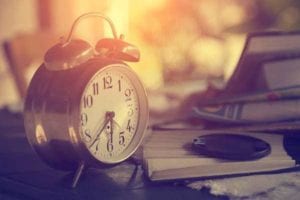 AA-Slogans-Clock-On-Table-Books-Open